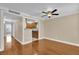 Open concept living room with kitchen view and hardwood floors at 526 Orange Dr # 37, Altamonte Springs, FL 32701