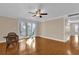 Bright living room with hardwood floors and sliding doors to balcony at 526 Orange Dr # 37, Altamonte Springs, FL 32701