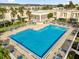L-shaped community pool, surrounded by patio furniture at 526 Orange Dr # 37, Altamonte Springs, FL 32701