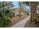 Paved walkway meandering through a tree-lined landscape at 533 Moree Loop, Winter Springs, FL 32708