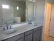 Elegant bathroom featuring a double vanity, soaking tub, and glass-enclosed shower at 5374 Lake Virginia St, Winter Garden, FL 34787