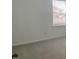 The bright bedroom is carpeted and has a large window with blinds and backyard view at 5374 Lake Virginia St, Winter Garden, FL 34787