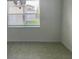 Bright dining area with a modern chandelier, large window, and tile flooring at 5374 Lake Virginia St, Winter Garden, FL 34787