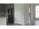 Spacious kitchen with gray cabinets, stainless steel refrigerator, and convenient pantry at 5374 Lake Virginia St, Winter Garden, FL 34787