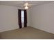 Spacious bedroom with ceiling fan and window coverings at 870 Regatta Bay Dr # 4-103, Orange City, FL 32763