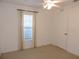 Well-lit bedroom with ceiling fan and window coverings at 870 Regatta Bay Dr # 4-103, Orange City, FL 32763