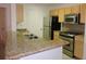 Kitchen with granite countertops and stainless steel appliances at 870 Regatta Bay Dr # 4-103, Orange City, FL 32763