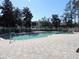Community pool with brick pavers and lounge chairs at 870 Regatta Bay Dr # 4-103, Orange City, FL 32763