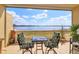Relaxing balcony with lake view and patio furniture at 8755 The Esplanade # 103, Orlando, FL 32836