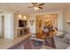 Open concept living area with hardwood floors and a view of the dining room at 8755 The Esplanade # 103, Orlando, FL 32836