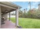 Covered patio with ceiling fans and access to a grassy backyard at 936 Jetway Street, Orange City, FL 32763