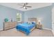 Blue bedroom with ceiling fan and built-in dresser at 936 Jetway Street, Orange City, FL 32763