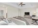 Spacious bedroom with large bed, TV, and ceiling fan at 936 Jetway Street, Orange City, FL 32763