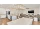 Kitchen dining area with a large white table and stylish light fixtures at 936 Jetway Street, Orange City, FL 32763