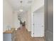 Bright and airy entryway with wood-look floors and modern light fixture at 936 Jetway Street, Orange City, FL 32763