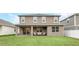 Two-story house with covered patio and backyard access at 936 Jetway Street, Orange City, FL 32763