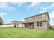 Two-story house with covered patio, fenced yard and neighborhood view at 936 Jetway Street, Orange City, FL 32763