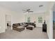 Spacious living area with sectional sofa and ceiling fan at 936 Jetway Street, Orange City, FL 32763