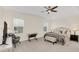 Main bedroom with carpeted floors, a large bed, and plenty of natural light at 936 Jetway Street, Orange City, FL 32763