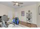 Bright home office with hardwood floors, large desk, and built-in shelving at 936 Jetway Street, Orange City, FL 32763