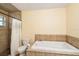 Bathroom with shower/tub combo, tile flooring, and a window at 9908 Fairway Cir, Leesburg, FL 34788