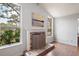 Brick fireplace with ornate screen in living room at 9908 Fairway Cir, Leesburg, FL 34788