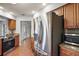 Stainless steel refrigerator in updated kitchen at 9908 Fairway Cir, Leesburg, FL 34788