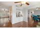 Open living space with hardwood floors and breakfast bar at 9908 Fairway Cir, Leesburg, FL 34788