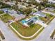 This aerial view showcases a home with solar panels, a fenced backyard, and a refreshing private swimming pool at 102 Aberdeen Dr, Fern Park, FL 32730