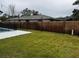 Fenced backyard with a pool and grassy area at 102 Aberdeen Dr, Fern Park, FL 32730