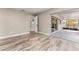 Bedroom with wood-look floors and sliding door access to the covered patio and pool area at 102 Aberdeen Dr, Fern Park, FL 32730