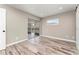 Bedroom featuring recessed lighting, wood-look floors, and access to an enclosed patio and pool at 102 Aberdeen Dr, Fern Park, FL 32730