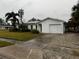 Single-story home with a large yard and attached garage at 102 Aberdeen Dr, Fern Park, FL 32730