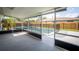 View of the screened-in pool area with an outdoor ceiling fan, overlooking a wood-fenced backyard at 102 Aberdeen Dr, Fern Park, FL 32730