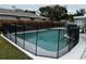 Inviting swimming pool with a safety fence at 102 Aberdeen Dr, Fern Park, FL 32730