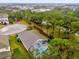 Aerial view showcasing home, pool, and tranquil neighborhood at 1037 Balmoral Dr, Davenport, FL 33896