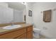 Clean bathroom with wood vanity, toilet and shower at 1037 Balmoral Dr, Davenport, FL 33896