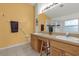 Double vanity bathroom with a shower and an adjacent bedroom at 1037 Balmoral Dr, Davenport, FL 33896