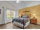 Bright bedroom with a queen-size bed and window at 1037 Balmoral Dr, Davenport, FL 33896