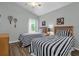 Guest bedroom with twin beds and wood floors at 1037 Balmoral Dr, Davenport, FL 33896