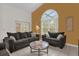 Living room with two sofas, a coffee table, and large windows at 1037 Balmoral Dr, Davenport, FL 33896