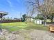 Large backyard with grassy area, storage shed, and basketball hoop at 1113 Matterhorn Street, Deltona, FL 32725