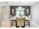 Dining room with a marble table and four chairs, leading to a patio at 1113 Matterhorn Street, Deltona, FL 32725