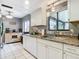 Kitchen with stainless steel appliances and white cabinets at 1113 Matterhorn Street, Deltona, FL 32725