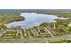 Aerial view showing property location near a lake and main road at 1158 Calle Del Norte # D, Casselberry, FL 32707