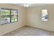 Bright bedroom with tile floors and multiple windows at 1158 Calle Del Norte # D, Casselberry, FL 32707