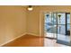 Bright living room with wood floors and access to balcony at 1158 Calle Del Norte # D, Casselberry, FL 32707