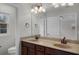 Double vanity bathroom with beige countertop and bronze fixtures at 1267 Marley Ln, Winter Springs, FL 32708