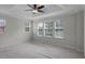 Main bedroom with ceiling fan, multiple windows, and plush carpeting at 1267 Marley Ln, Winter Springs, FL 32708