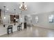 Open concept dining area with tile flooring and a chandelier at 1267 Marley Ln, Winter Springs, FL 32708